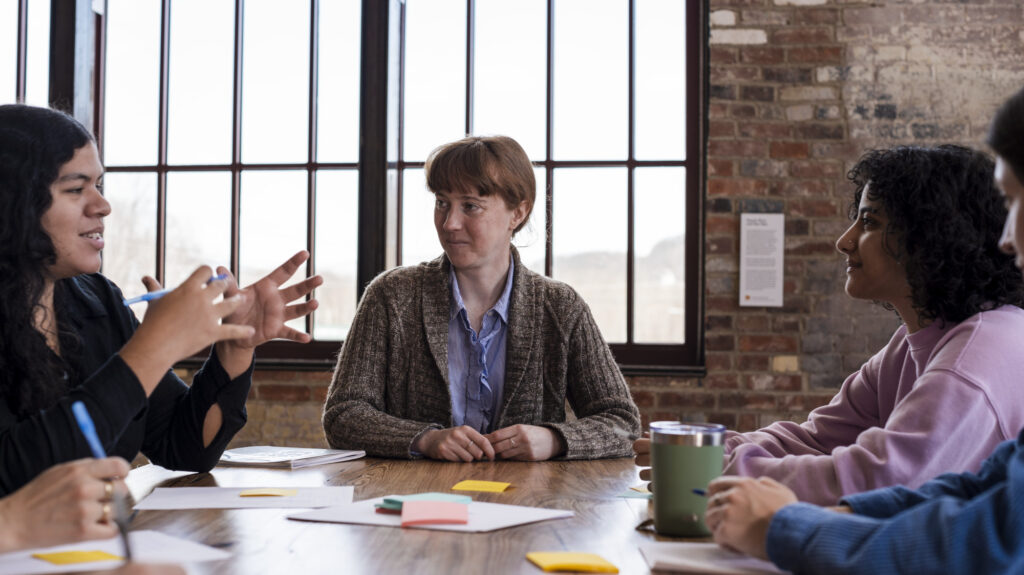 ssistant director Molly Rideout talks wtih artists as Assets for Artists holds a workshop in the Prow of Mass MoCA. Press photo by Sofia Taylor, courtesy of Assets 4 Artists
