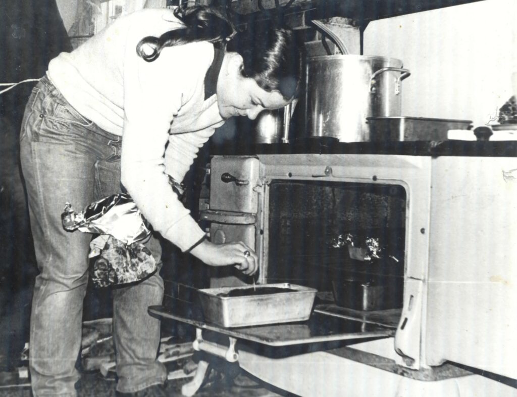 A student bakes bread at the Center for Resourceful Living. Press photo courtesy of the Archives of Freel Library, Massachusetts College of Liberal Arts