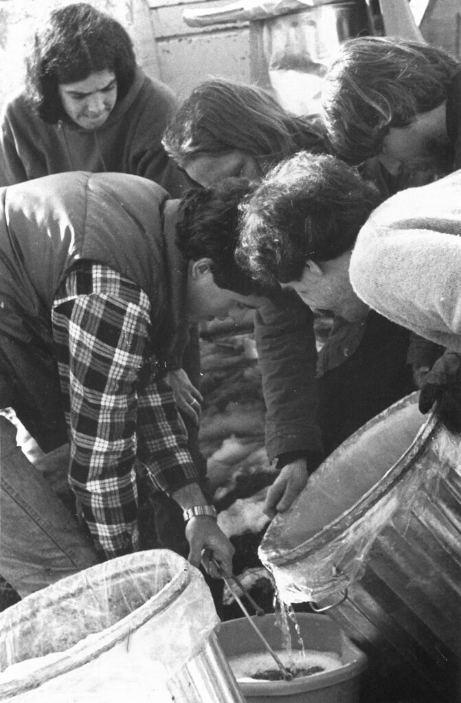 Students gather sap for maple syrup at the Center for Resourceful Living. Press photo by Paul Vogt courtesy of the artist