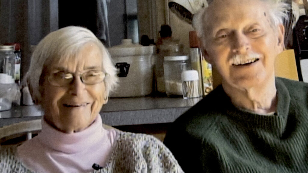 Betty and Larry Vadnais speak in their kitchen. Film still courtesy of Sharon Wyrrick