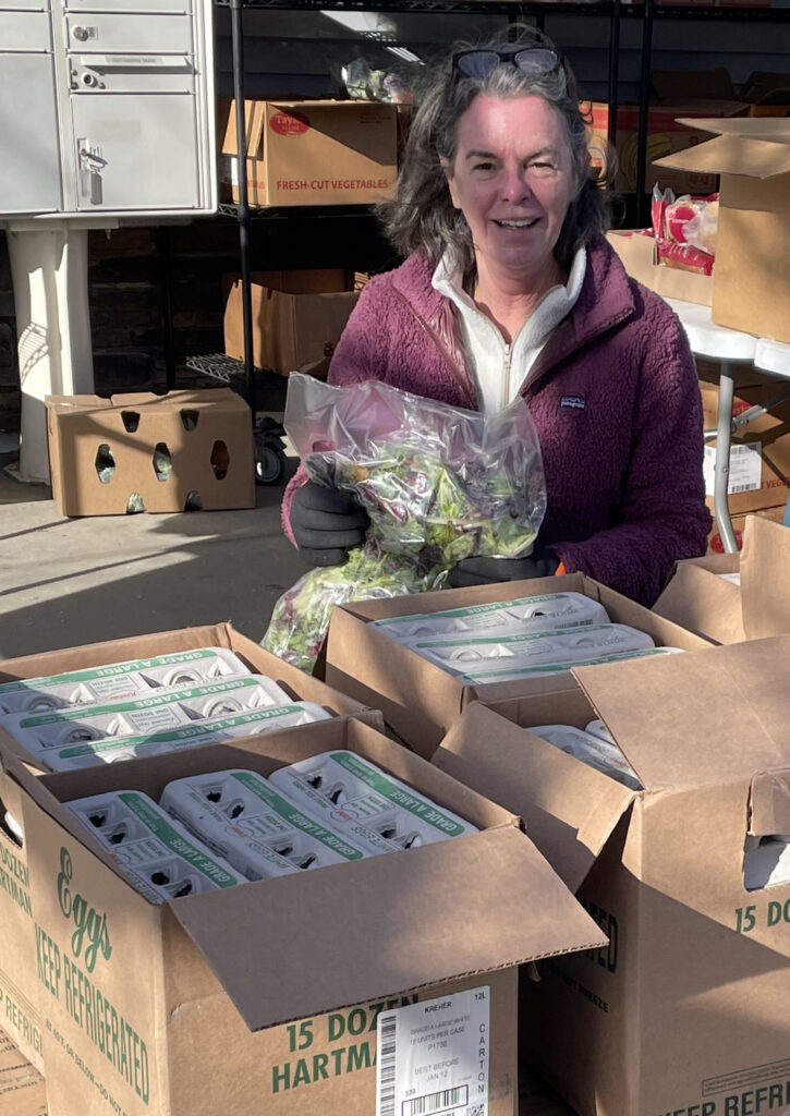 Volunteers for Berkshire Bounty pack boxes to deliver to meal sites and food pantries. Press photo courtesy of Berkshire Bounty